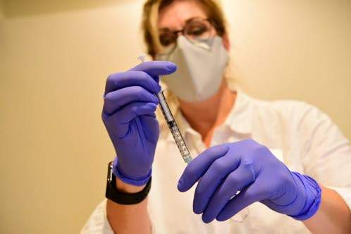 WHO: Key workers, other vulnerable people to receive COVID vaccines